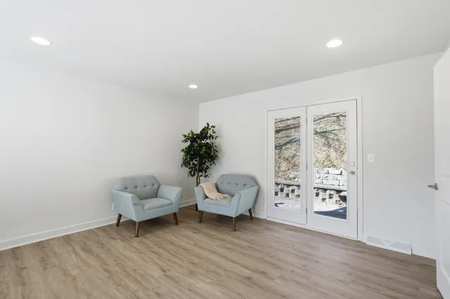 a view of a house with a wooden deck