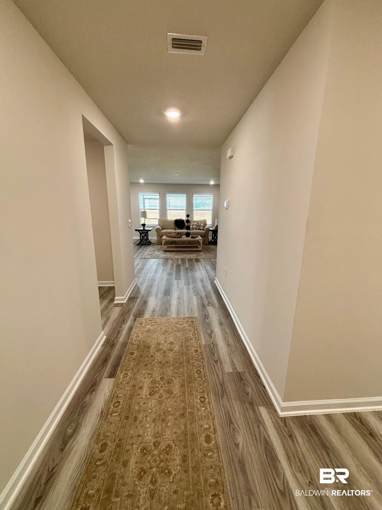 22215 Aleutian Avenue Foley, AL 36535 - Photo 3 of 34 Hallway with hardwood / wood-style flooring