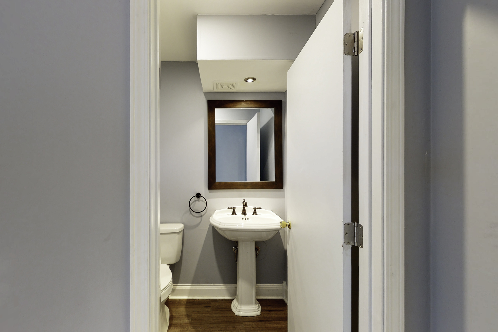 538 Russell Road DeKalb, IL 60115 - Photo 13 of 35 a bathroom with a sink and a mirror