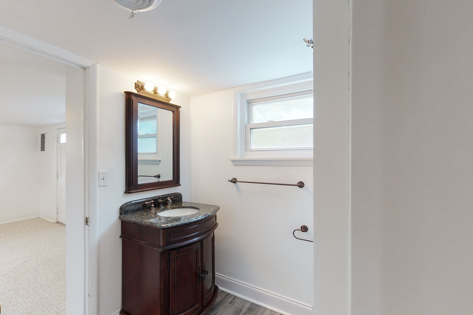 538 Russell Road DeKalb, IL 60115 - Photo 17 of 35 a bathroom with a sink and a mirror