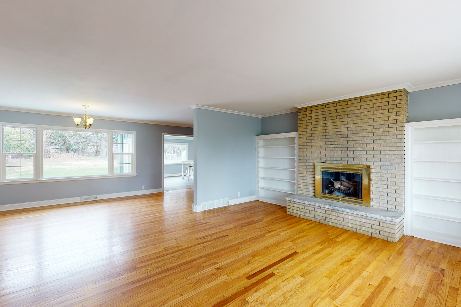 538 Russell Road DeKalb, IL 60115 - Photo 7 of 35 a view of a livingroom with a fireplace and window