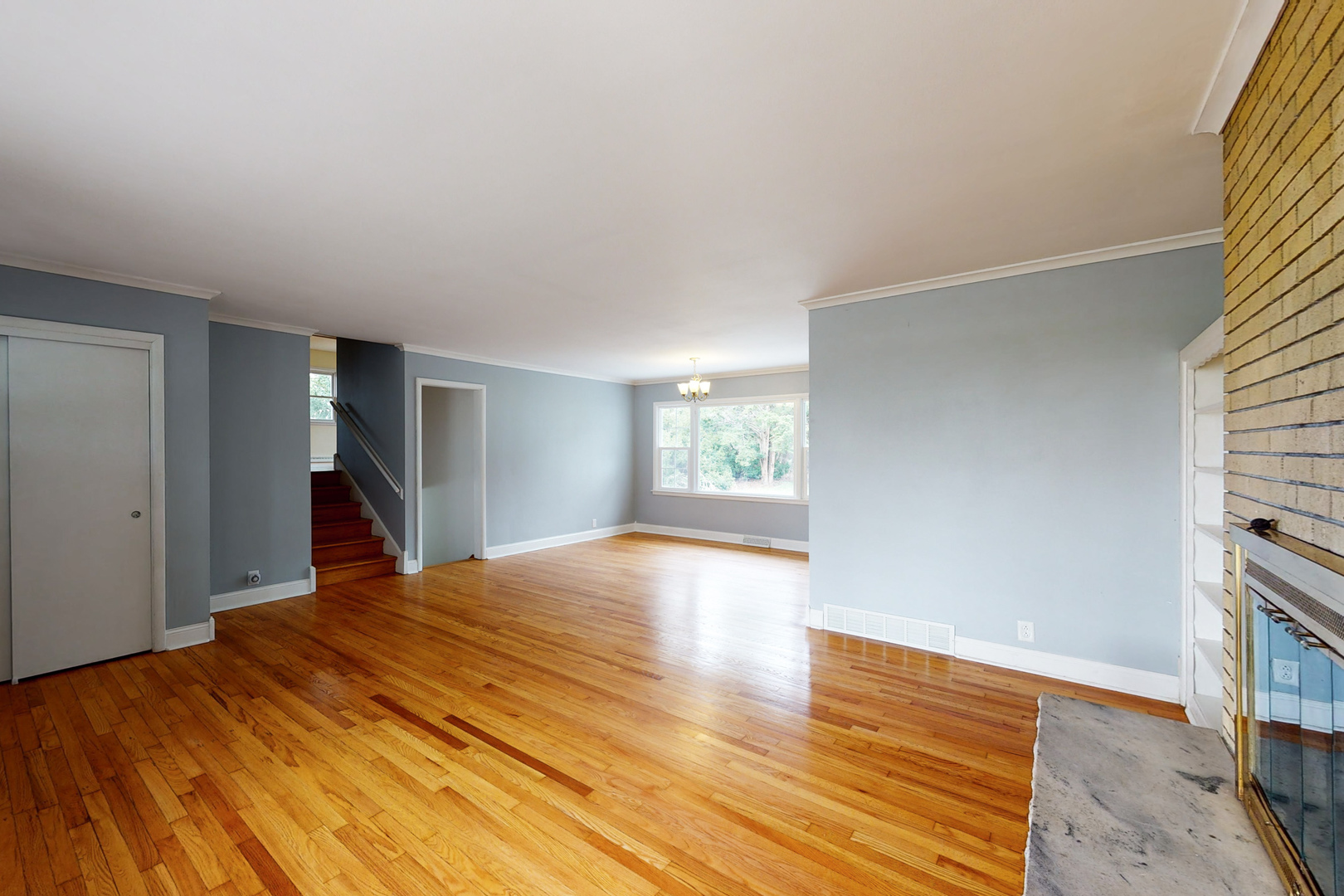 538 Russell Road DeKalb, IL 60115 - Photo 8 of 35 a view of empty room with wooden floor and fan