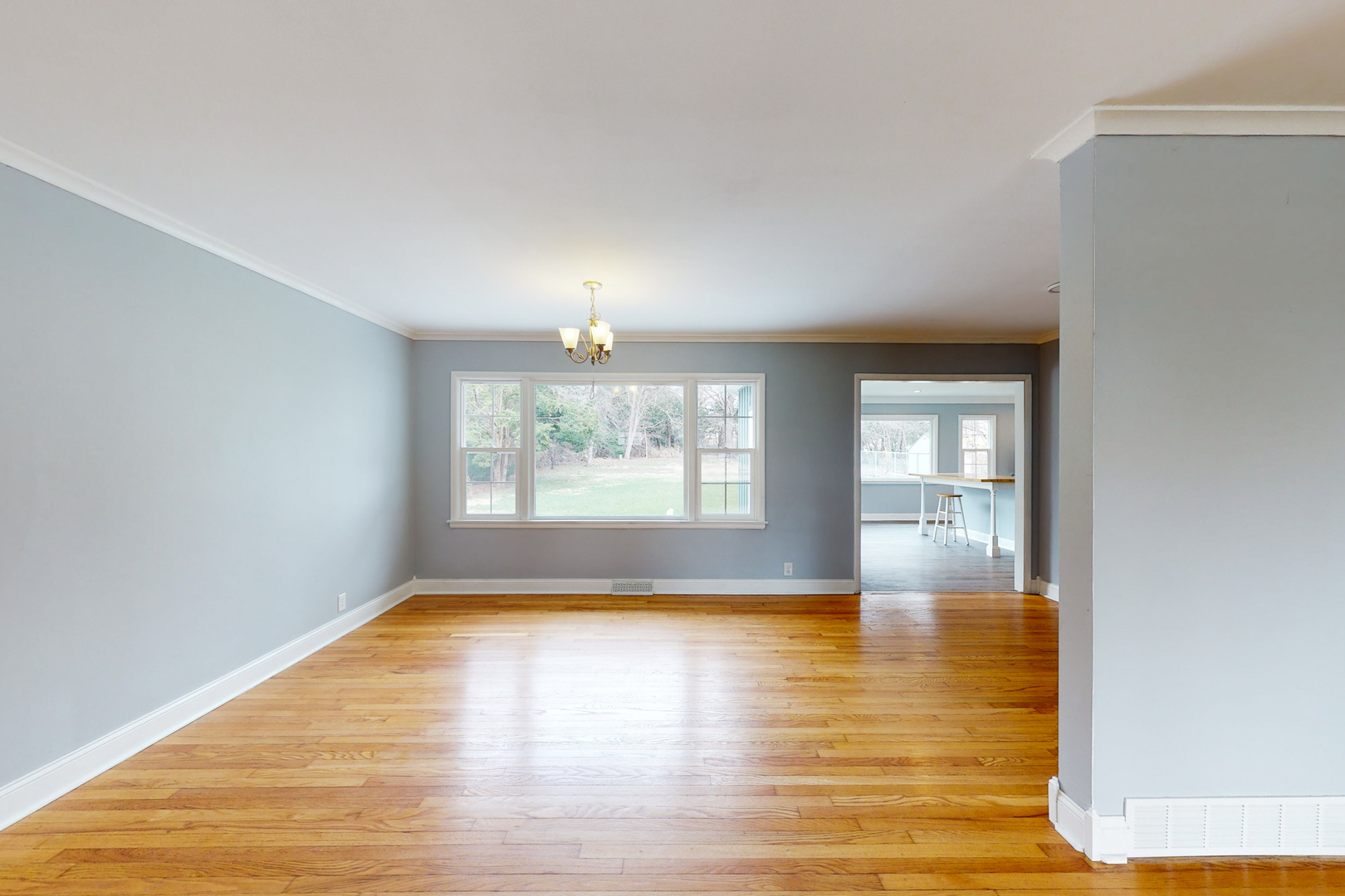 538 Russell Road DeKalb, IL 60115 - Photo 10 of 35 a view of empty room with wooden floor and fan