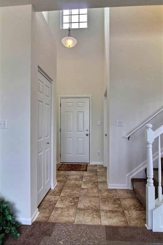 5780 Burr Rdg Circle Crown Point, IN 46307 - Photo 4 of 17 a view of a livingroom with wooden floor and chair