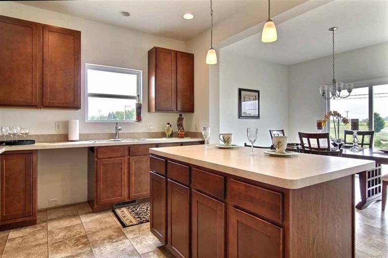 5780 Burr Rdg Circle Crown Point, IN 46307 - Photo 6 of 17 a kitchen with a sink stove and cabinets
