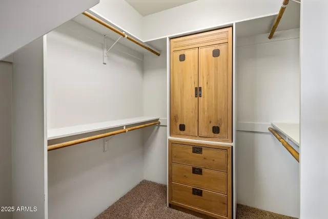 a view of an empty walk in closet