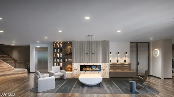 a lobby with furniture and a fireplace