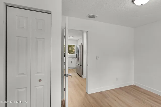 a view of a bathroom with wooden floor