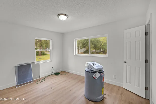 a view of workspace with furniture and window