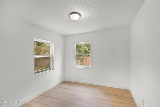 an empty room with windows