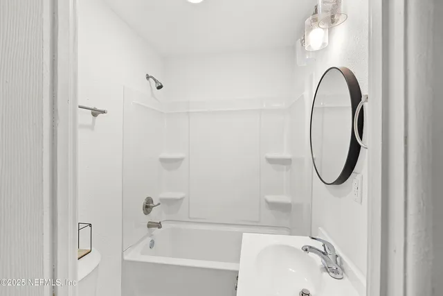 a bathroom with a sink a toilet and a bathtub