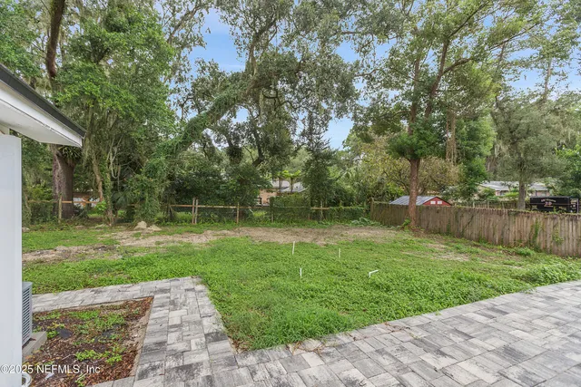 a view of backyard with green space