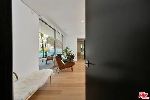 a outdoor living space with furniture and a flat screen tv