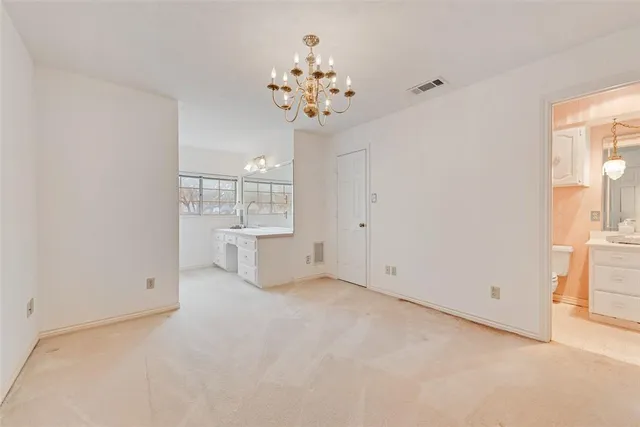 a bathroom with a sink vanity granite tub shower and a mirror