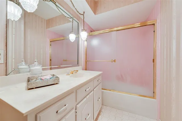 a spacious bedroom with a bed and a window