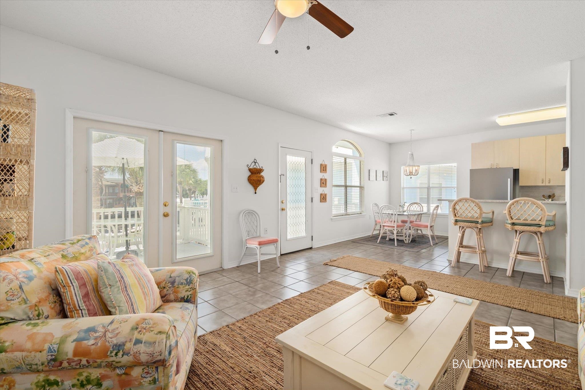 3575 Bayou Road, Unit A 10 Orange Beach, AL 36561 - Photo 8 of 31 Living room featuring spectacular views, plenty of natural light, and light tile patterned floors