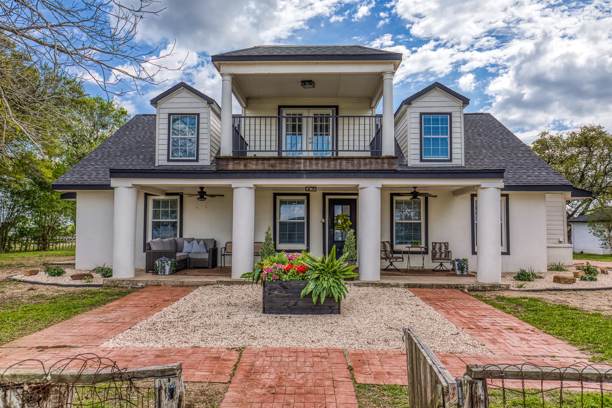 1289 Bluebonnet Ridge Drive Chappell Hill, TX 77426 - Photo 1 of 44 a front view of a house with garden