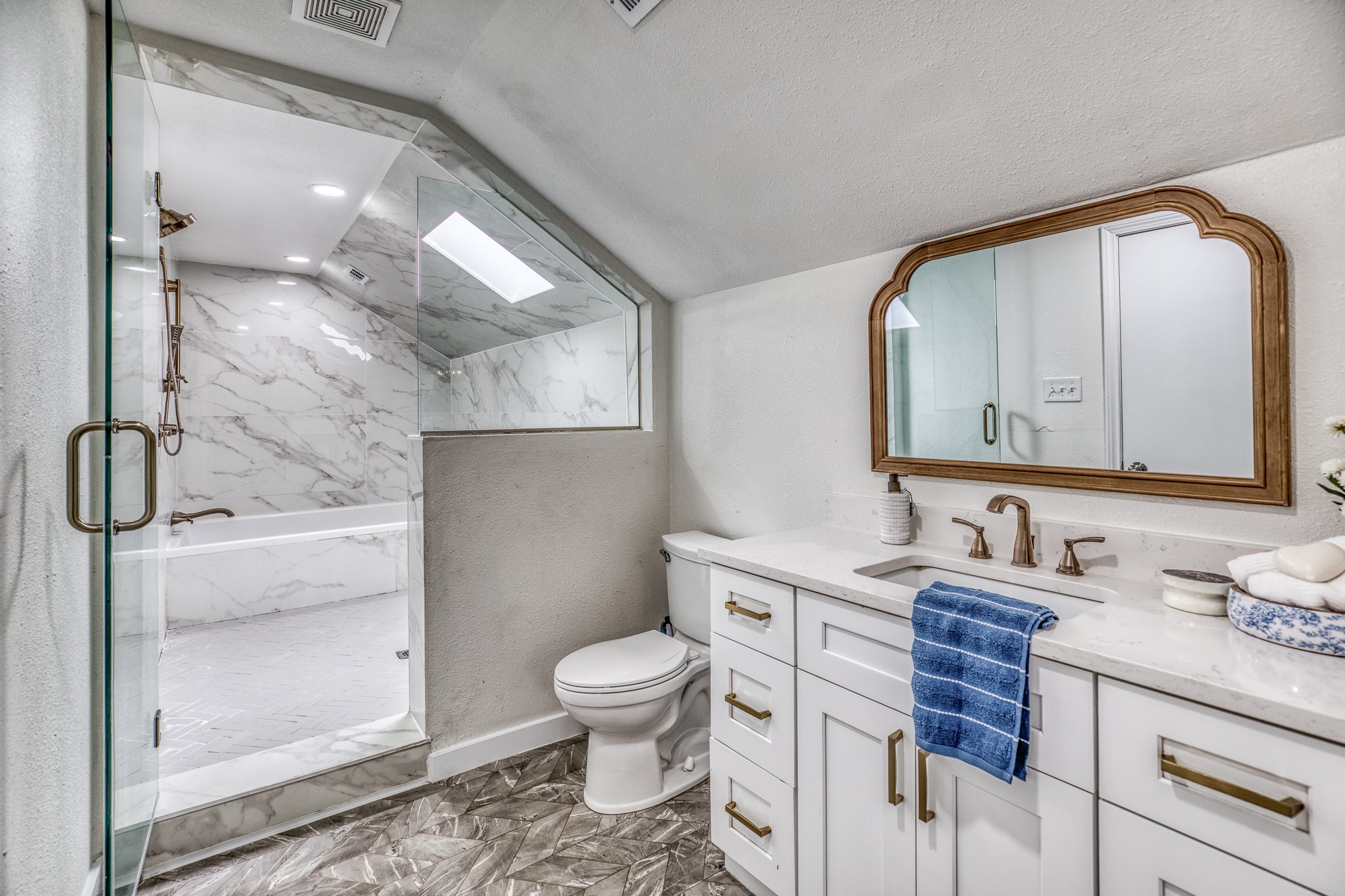 1289 Bluebonnet Ridge Drive Chappell Hill, TX 77426 - Photo 16 of 44 a bathroom with a granite countertop toilet sink and mirror