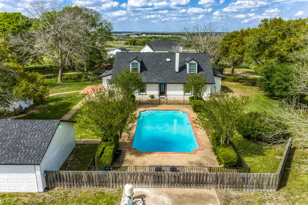 a view of swimming pool with a garden