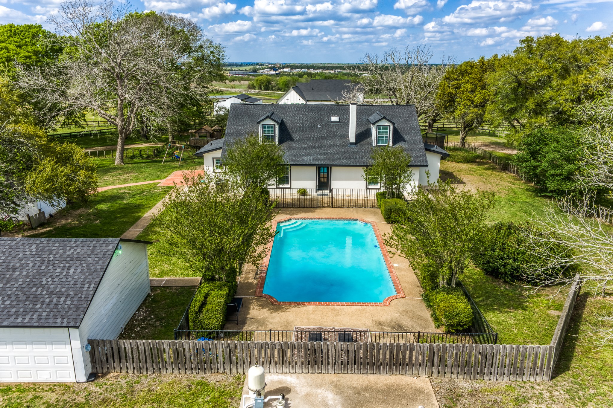1289 Bluebonnet Ridge Drive Chappell Hill, TX 77426 - Photo 19 of 44 an aerial view of a house with swimming pool