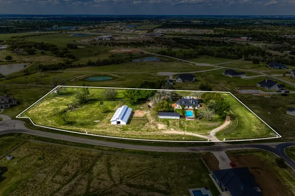 a living room with furniture ceiling fan and a window