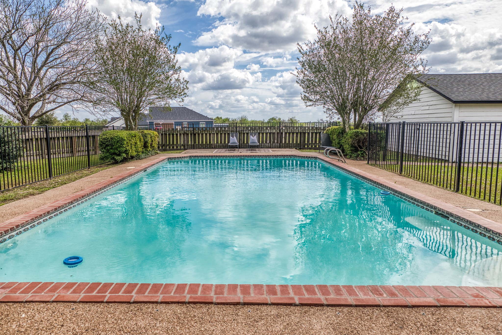 1289 Bluebonnet Ridge Drive Chappell Hill, TX 77426 - Photo 21 of 44 a view of a swimming pool with a yard