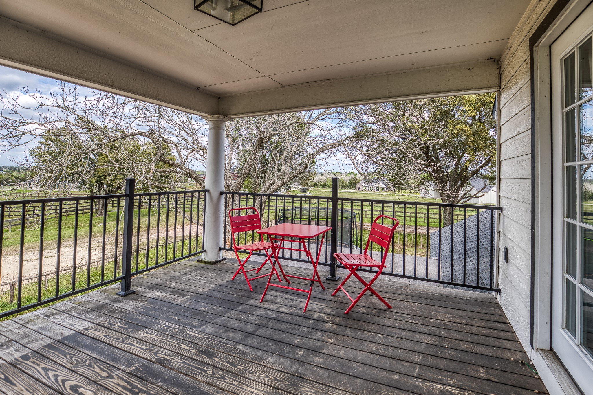 1289 Bluebonnet Ridge Drive Chappell Hill, TX 77426 - Photo 22 of 44 a view of a deck with wooden floor and outdoor space