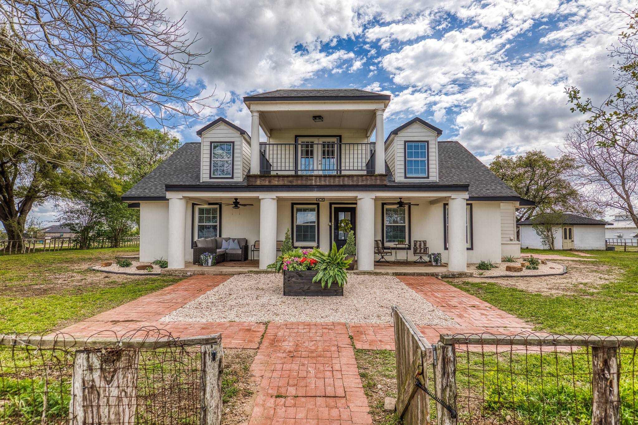 1289 Bluebonnet Ridge Drive Chappell Hill, TX 77426 - Photo 28 of 44 a front view of a house with garden