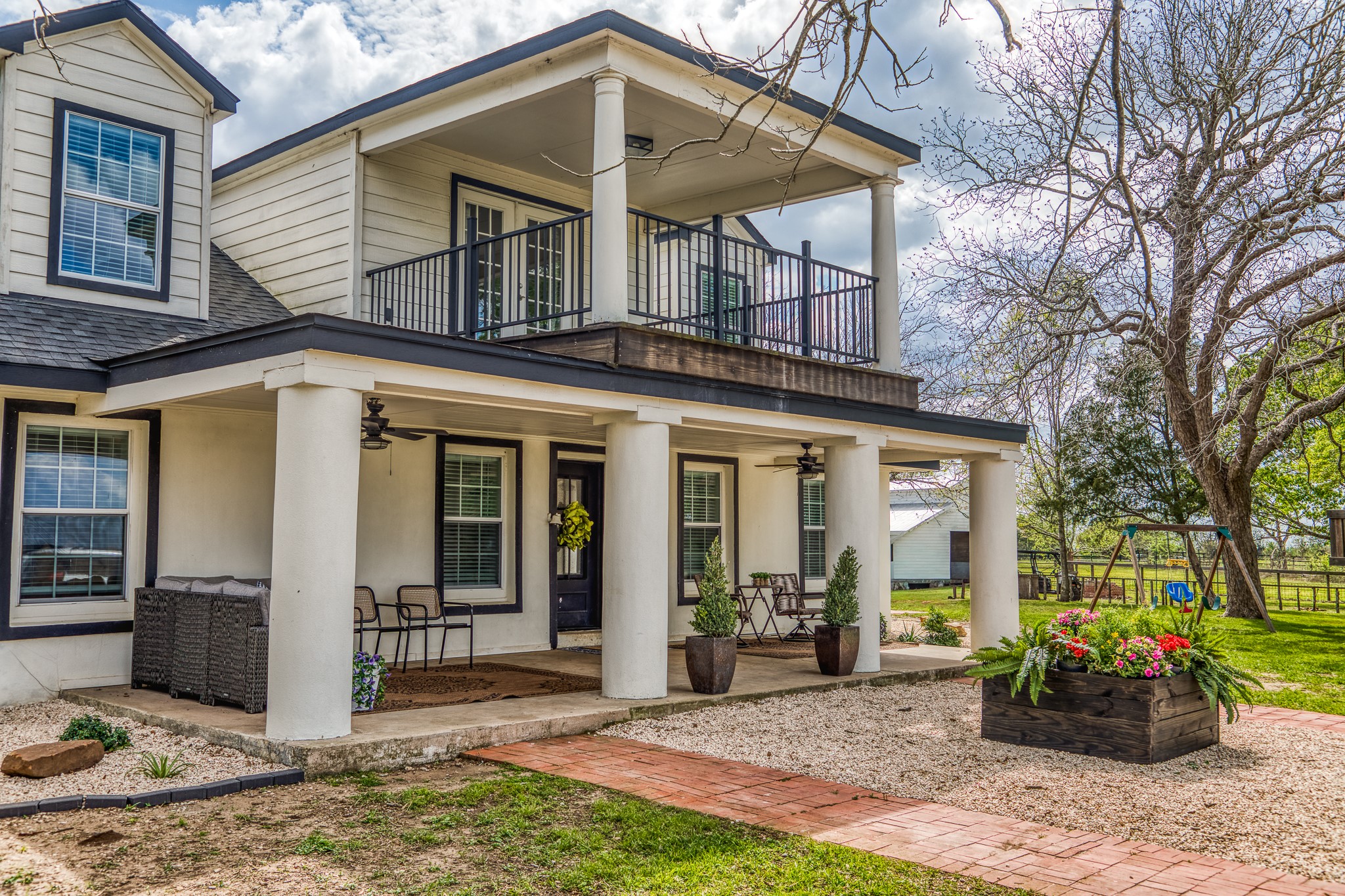 1289 Bluebonnet Ridge Drive Chappell Hill, TX 77426 - Photo 29 of 44 a front view of a house with garden