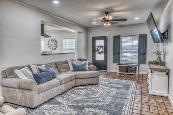 a living room with furniture and a fireplace