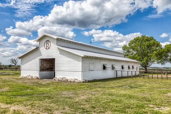 a view of a golf course with a houses