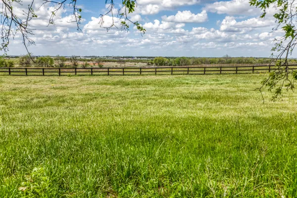 a view of a swimming pool with a yard