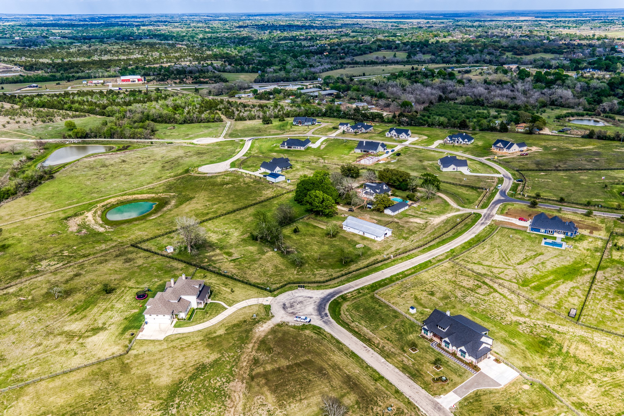 1289 Bluebonnet Ridge Drive Chappell Hill, TX 77426 - Photo 38 of 44 an aerial view of residential houses with outdoor space