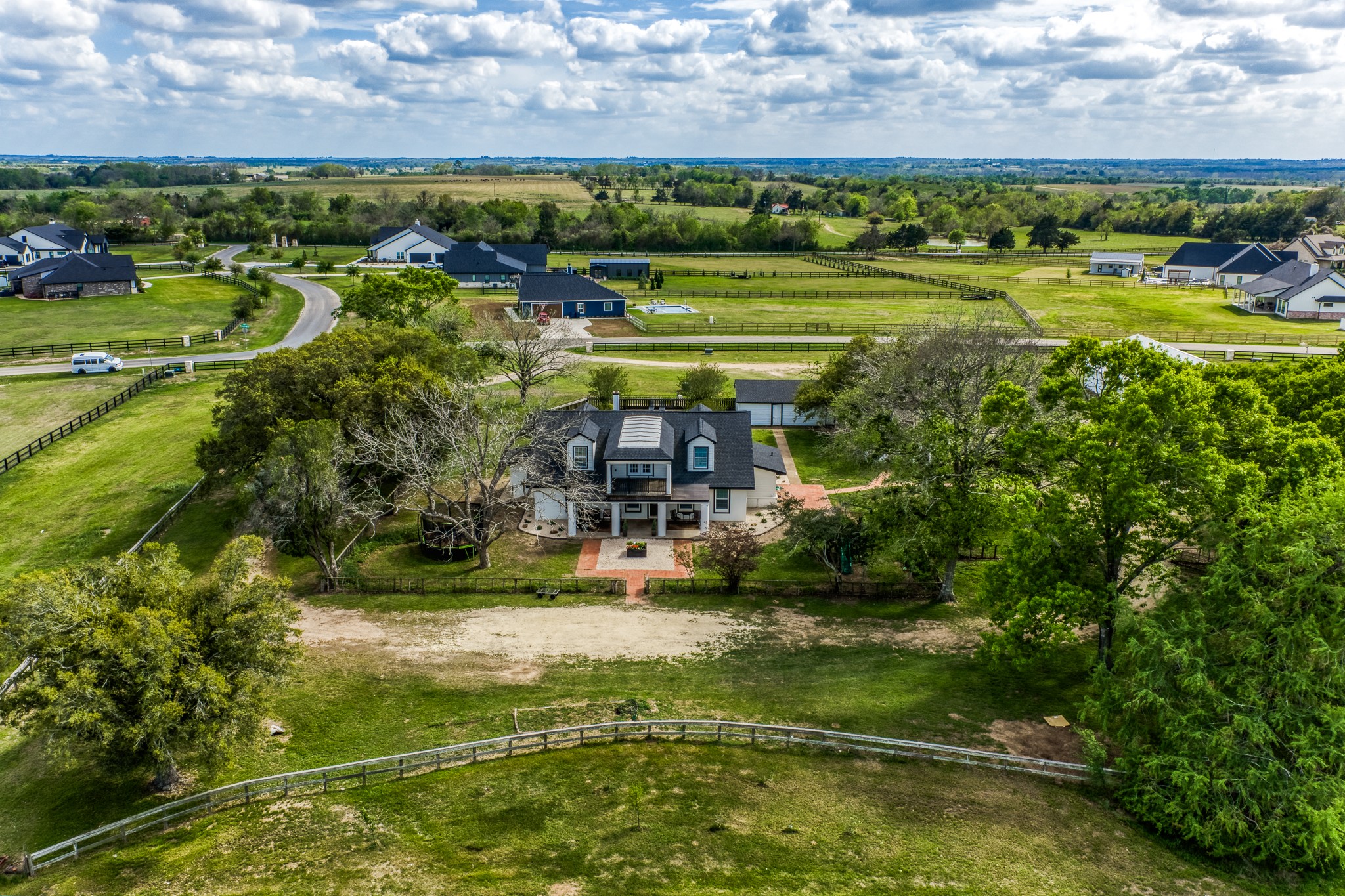 1289 Bluebonnet Ridge Drive Chappell Hill, TX 77426 - Photo 39 of 44 a view of a lake with a building in the background
