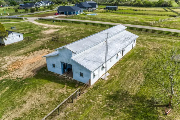 a view of a yard with table and chairs