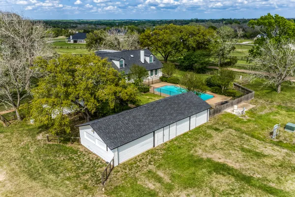 an aerial view of a house with a garden