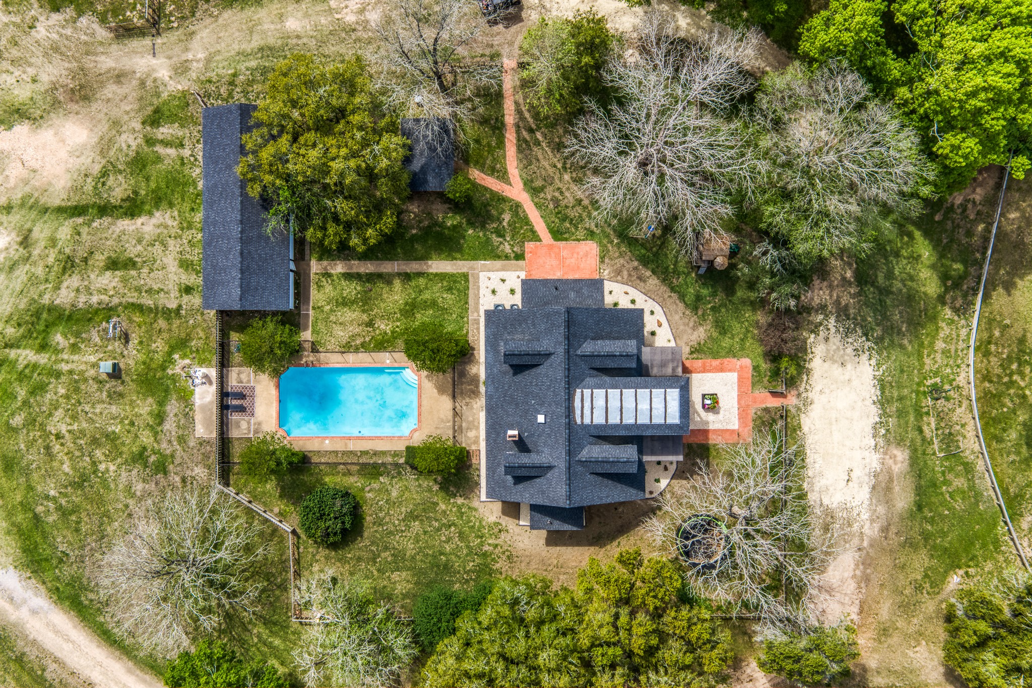 1289 Bluebonnet Ridge Drive Chappell Hill, TX 77426 - Photo 44 of 44 an aerial view of residential house with outdoor space and trees all around