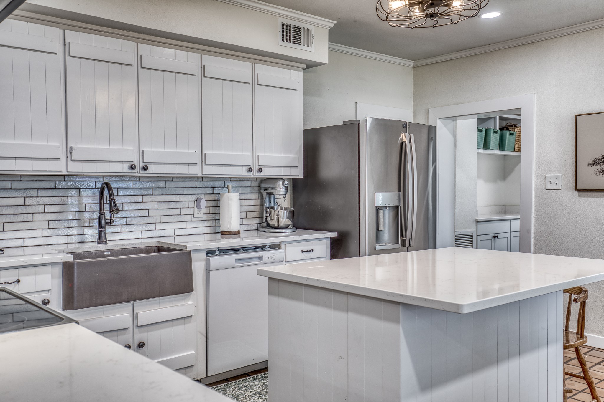 1289 Bluebonnet Ridge Drive Chappell Hill, TX 77426 - Photo 6 of 44 a kitchen with stainless steel appliances granite countertop a refrigerator sink and cabinets