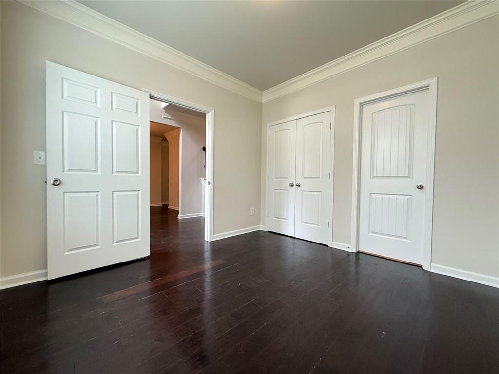 2467 Overlook Avenue Lithonia, GA 30058 - Photo 16 of 51 an empty room with wooden floor & closet area