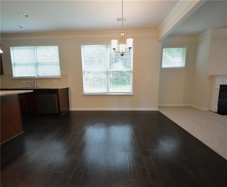 2467 Overlook Avenue Lithonia, GA 30058 - Photo 23 of 51 an empty room with wooden floor and windows