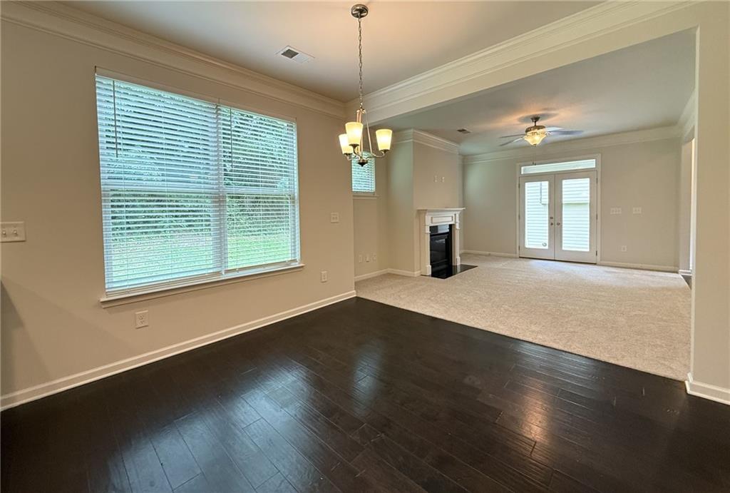 2467 Overlook Avenue Lithonia, GA 30058 - Photo 25 of 51 a view of an empty room with wooden floor and a window