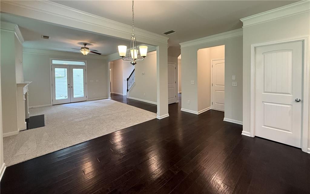 2467 Overlook Avenue Lithonia, GA 30058 - Photo 26 of 51 an empty room with wooden floor and windows