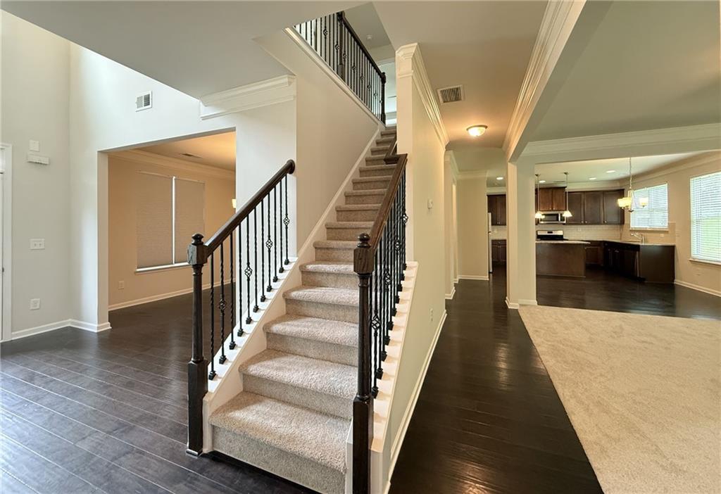 2467 Overlook Avenue Lithonia, GA 30058 - Photo 32 of 51 a view of a hallway with wooden floor and staircase