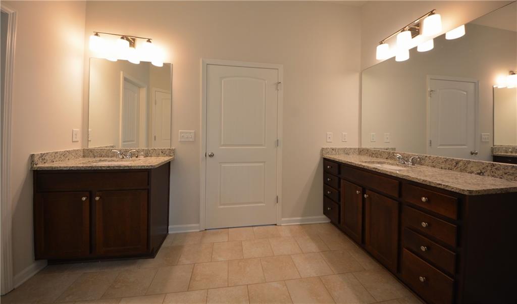 2467 Overlook Avenue Lithonia, GA 30058 - Photo 40 of 51 a bathroom with a sink vanity and a mirror
