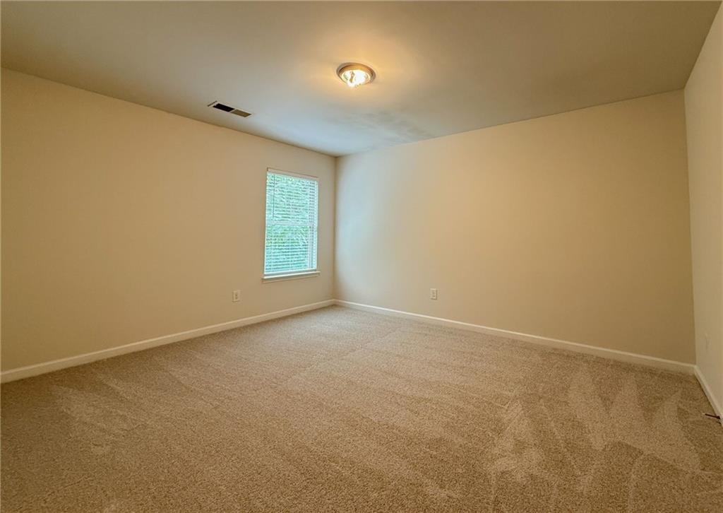 2467 Overlook Avenue Lithonia, GA 30058 - Photo 49 of 51 an empty room with windows