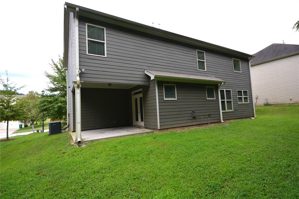 2467 Overlook Avenue Lithonia, GA 30058 - Photo 5 of 51 a view of a house with a yard