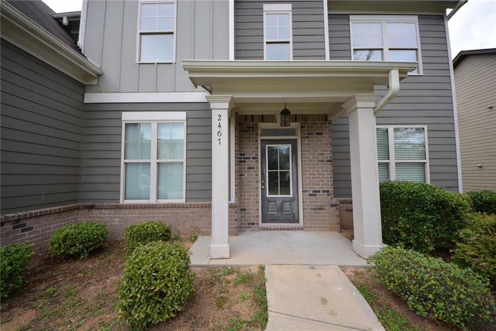 2467 Overlook Avenue Lithonia, GA 30058 - Photo 6 of 51 a front view of a house with garden