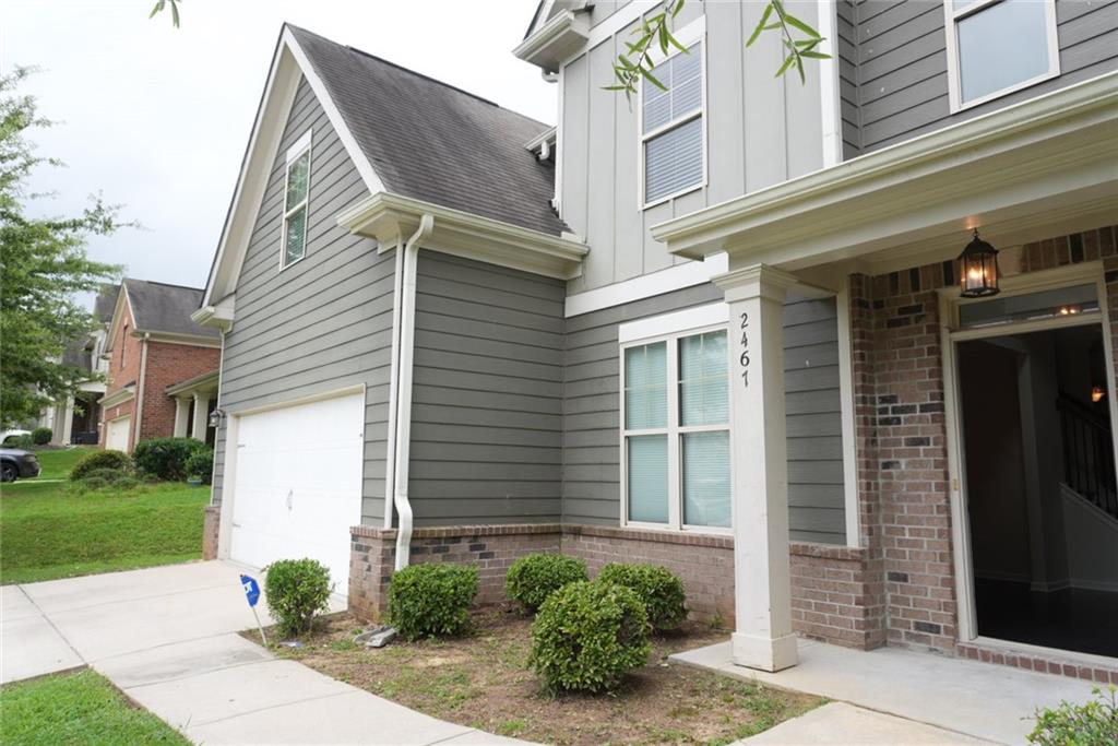 2467 Overlook Avenue Lithonia, GA 30058 - Photo 7 of 51 a view of a house with a yard