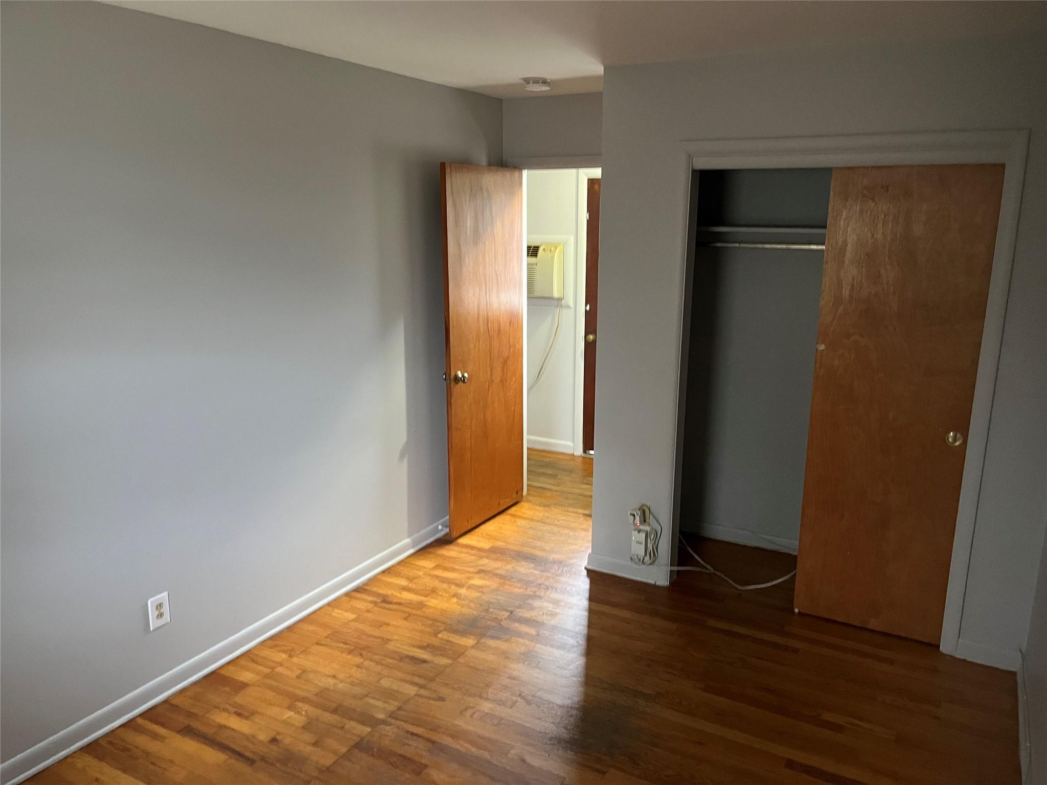 96 South Hamilton Street, Unit B6 Poughkeepsie, NY 12601 - Photo 5 of 9 a view of an empty room with wooden floor and closet