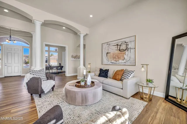 a living room with furniture and a table